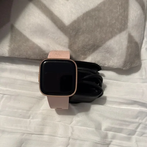 Fitbit Smartwatch with Pink and Black Band - Picture 1 of 3